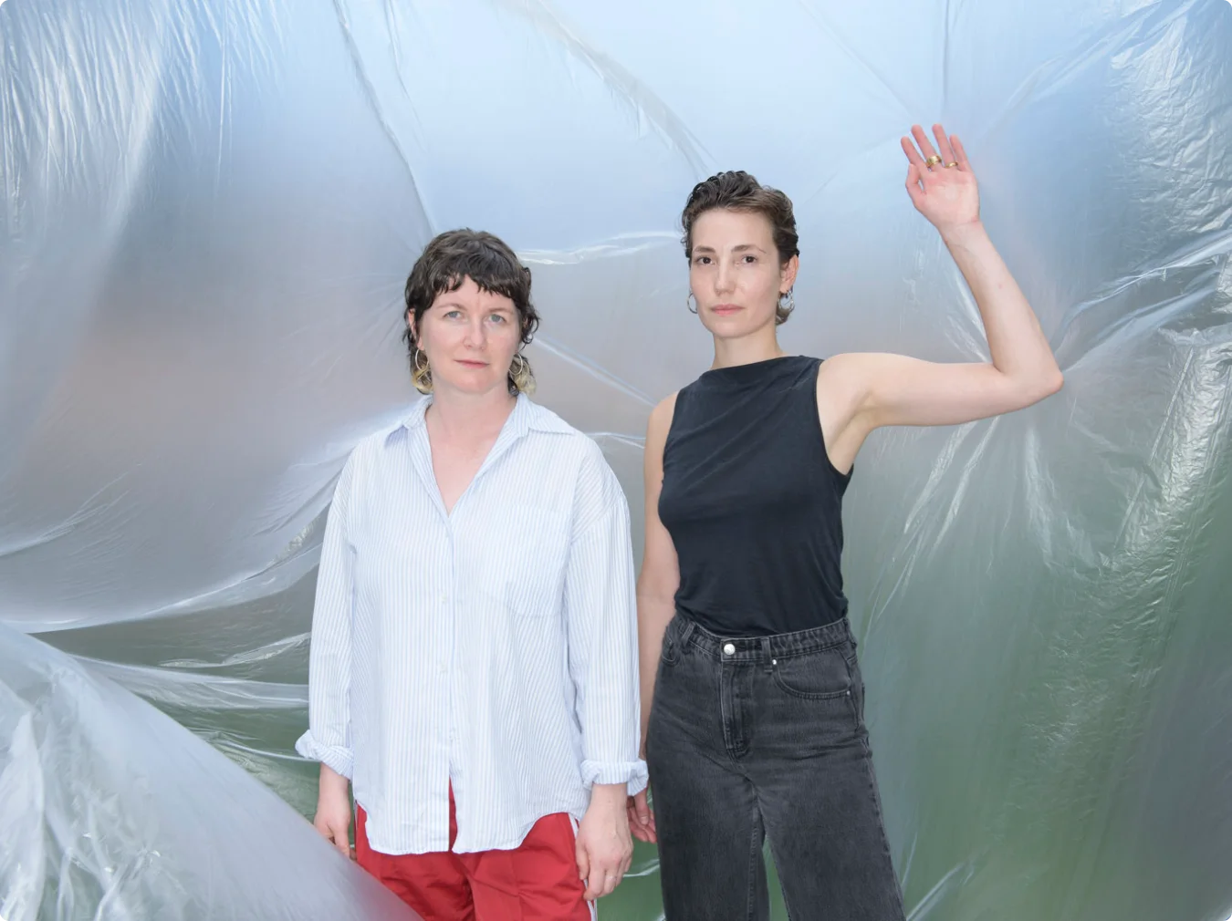 The two founders of FRENDZ.CLUB in front of a foil wall